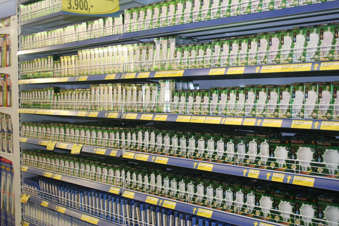 Shelves of compact fluorescent lamps in an Indonesian retail store