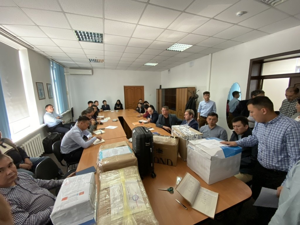 Sealed bid boxes being opened at a public bid opening