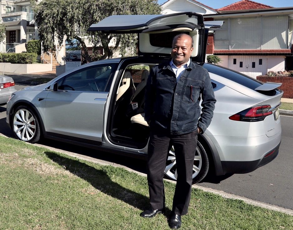 Sohail Hasnie with a Tesla Model X on test drive in suburban Australia, 2018